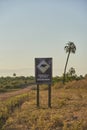 Signage with the drawing of a capybara and the text Slow down. Wildlife crossing