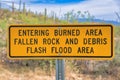 Signage with Entering Burned Area Falling Rocks and Debris Flashflood Area at Tucson, AZ Royalty Free Stock Photo