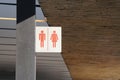 Signage indicating location or toilet position for men and women.