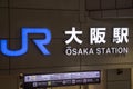 Signage of Osaka JR station in front of the train station building