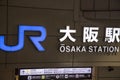 Signage of Osaka JR station in front of the train station building