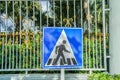 Signage of people crossing road Royalty Free Stock Photo