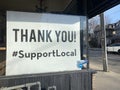 TORONTO, ONTARIO, CANADA - MARCH 22, 2021: SIGNAGE SUPPORTING LOCAL BUSINESS DURING COVID-19 PANDEMIC.