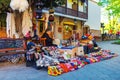 Woman female vendor sells and knits woolen slippers and socks in Sighnaghi town, Kakheti region, Georgia