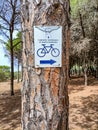 Sardinia. Eco-soustainable tourism. Cycle touring. Signal on a tree