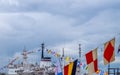 Signal flags are coloring on ships during the holiday against the backdrop of a dramatic sky