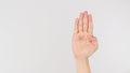 Signal for Help.Palm to camera and tuck thumb hand sign on white background