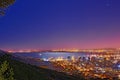 Signal Hill in Cape Town South Africa with copyspace against dark night sky background and the view of a coastal city Royalty Free Stock Photo