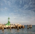 Signal light and breakwaters at the harbor Royalty Free Stock Photo