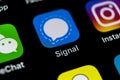 Signal messenger application icon on Apple iPhone X smartphone screen close-up. Signal messenger app icon. Social media network.