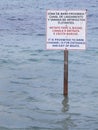 Signal post on the water. Prohibited to swim