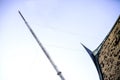 Signal tower And the roof of an ancient Thai house Royalty Free Stock Photo