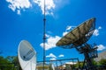 Signal Tower and Sky satellite dish are large and the clouds are white as a backdrop, high telecommunication signal, wireless Royalty Free Stock Photo