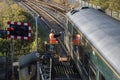 Signalman handing a key to train driver for travel on a single rail track