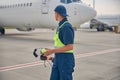 Signalman in uniform standing at the airdrome