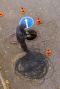signalman worker pulling an electric cable through the city well Royalty Free Stock Photo