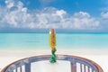 Signature new year celebration tropical cocktail on the glass table at the beach with ocean Royalty Free Stock Photo