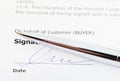 Signature of sales agreement and silver pen Royalty Free Stock Photo