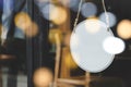 Signboard. blank vintage wooden sign board hanging on glass door with bokeh light in modern cafe restaurant Royalty Free Stock Photo