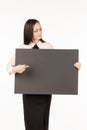 Signboard. Business woman with a big black card. on a white back Royalty Free Stock Photo