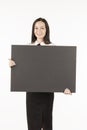 Signboard. Business woman with a big black card. on a white back Royalty Free Stock Photo