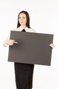 Signboard. Business woman with a big black card. on a white back Royalty Free Stock Photo