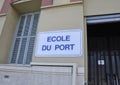 Signboard with Ecole du Port on the wall of the building from the Port Lympia in Nice