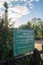 Signboard and fragment of the monument on Riga fountain in the small park in front of the Rizhskiy Railway Station in Moscow.