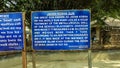 A signboard with information in English outside the Jahan Posha Gun heritage site