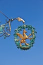 Signboard with lion and eagle above the entrance of a restaurant