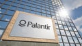 Signboard with Palantir Technologies logo next to the modern skyscraper, illustrative editorial 3D rendering Royalty Free Stock Photo