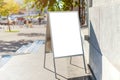 Signboard on the street. Angled empty menu board stand. Restaurant sidewalk white sign board. Freestanding A-frame advertising Royalty Free Stock Photo
