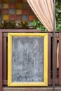 Signboard on the street. Empty menu board stand. Restaurant sidewalk chalkboard sign board. Blackboard near outdoor cafe with Royalty Free Stock Photo