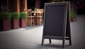 Signboard on the street. Empty menu board stand. Restaurant sidewalk chalkboard sign board. Freestanding Royalty Free Stock Photo