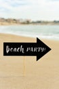 Signboard with the text beach party on the beach Royalty Free Stock Photo