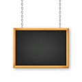 Signboard in a wooden frame hanging on a metal chain. Restaurant menu board. School chalkboard, writing surface for text Royalty Free Stock Photo