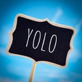 Signboard with the word yolo, vignetted