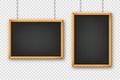 Signboards in a wooden frame hanging on a metal chain. Restaurant menu board. School chalkboard, writing surface for Royalty Free Stock Photo