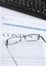 Signed contract paper with glasses Royalty Free Stock Photo