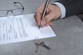 Signed house purchase agreement after the loan approval. Royalty Free Stock Photo