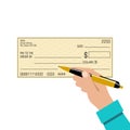 Signing a bank check. Pen in the hand Royalty Free Stock Photo