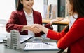 Signing a contract. Client and broker agent, lease agreement, successful deal and Young business sitting at the desk in office Royalty Free Stock Photo