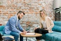 Signing the contract. Two business people, man and woman sitting at the table in the office and signing contract. Pretty Royalty Free Stock Photo