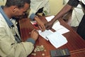 Signing with a fingerprint by Ethiopian woman