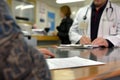 signing medical document, focus on female hands, putting signature at official paper, Royalty Free Stock Photo