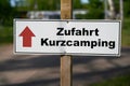 Signpost on a campsite in Germany with the inscription Access short camping