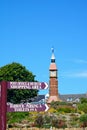 Signpost and clock tower, Seaton.