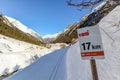 Signpost at Cross-country skiing trail through the Pitztal near Sankt Leonhard in Tirol, winter sports in snowy landscape in the Royalty Free Stock Photo