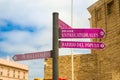 Signpost in CÃ¡diz promenade behind the CÃ¡diz Cathedral