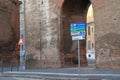 Signpost direction and ancient wall in Rome